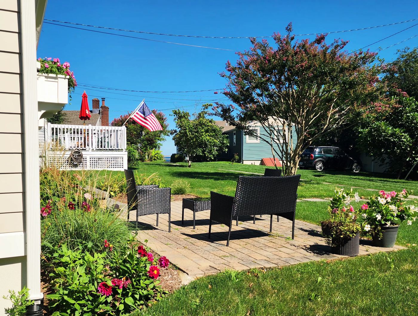 Front patio seating at Cottage 4 with a view toward Peconic Bay