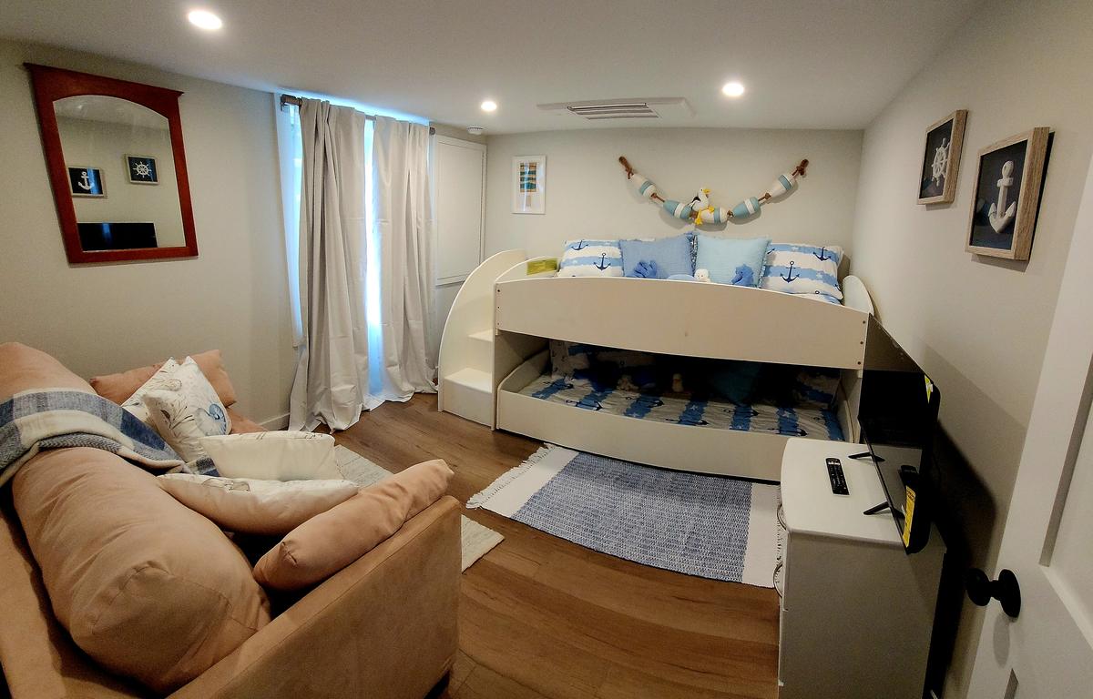 A nautical-themed downstairs room for sleeping, reading, and play