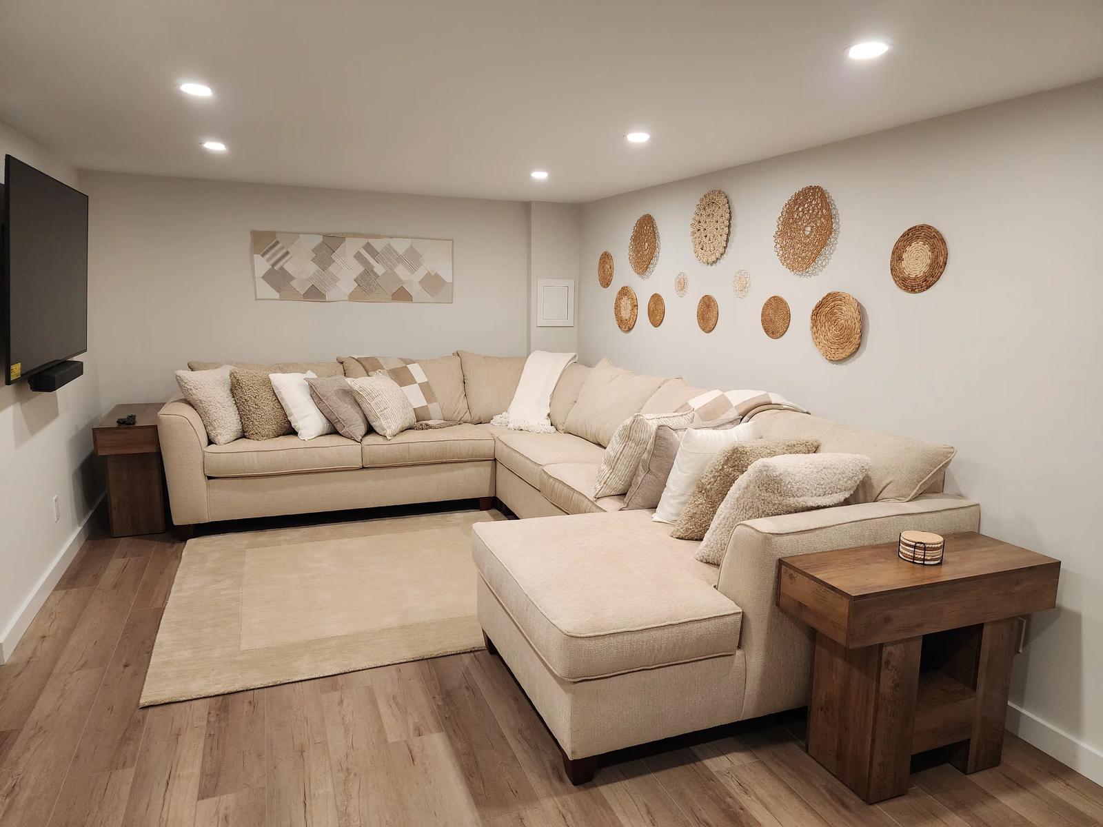 Downstairs movie and game family room with a large sectional