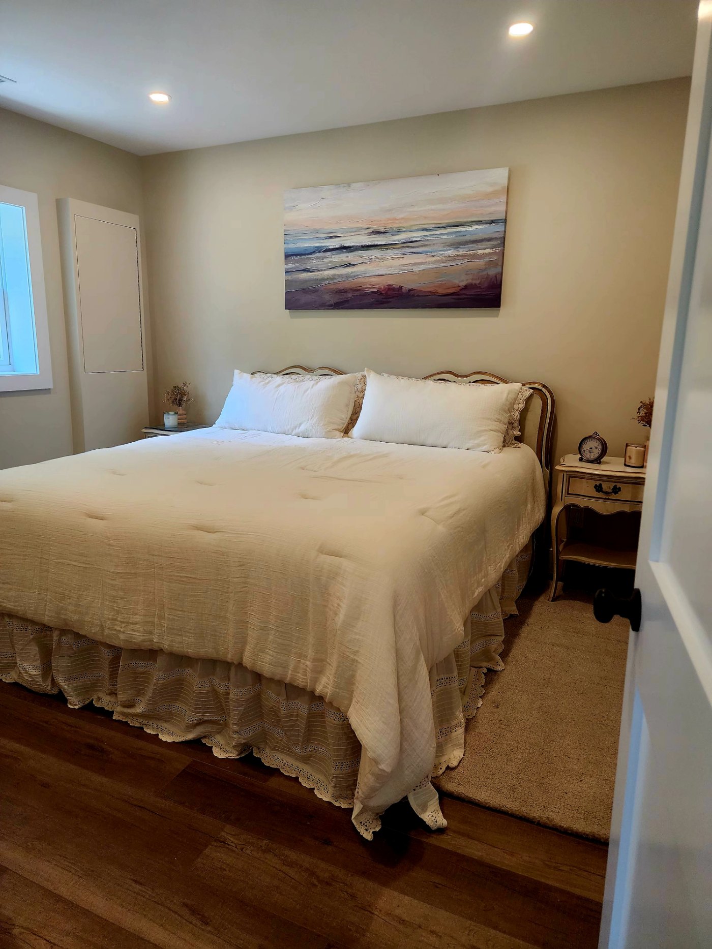 The primary suite, with a king bed and Jean and Joe's original French Provincial bedroom set