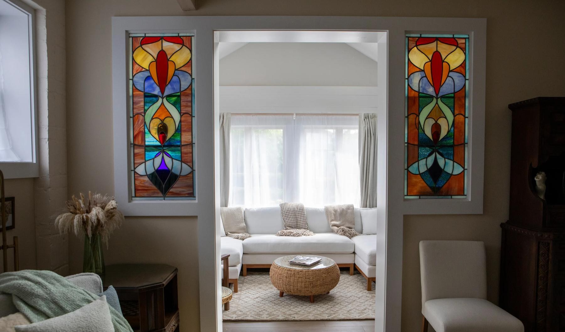 Handmade stained glass windows flanking the entrance to the sunroom at Casa di Rottino